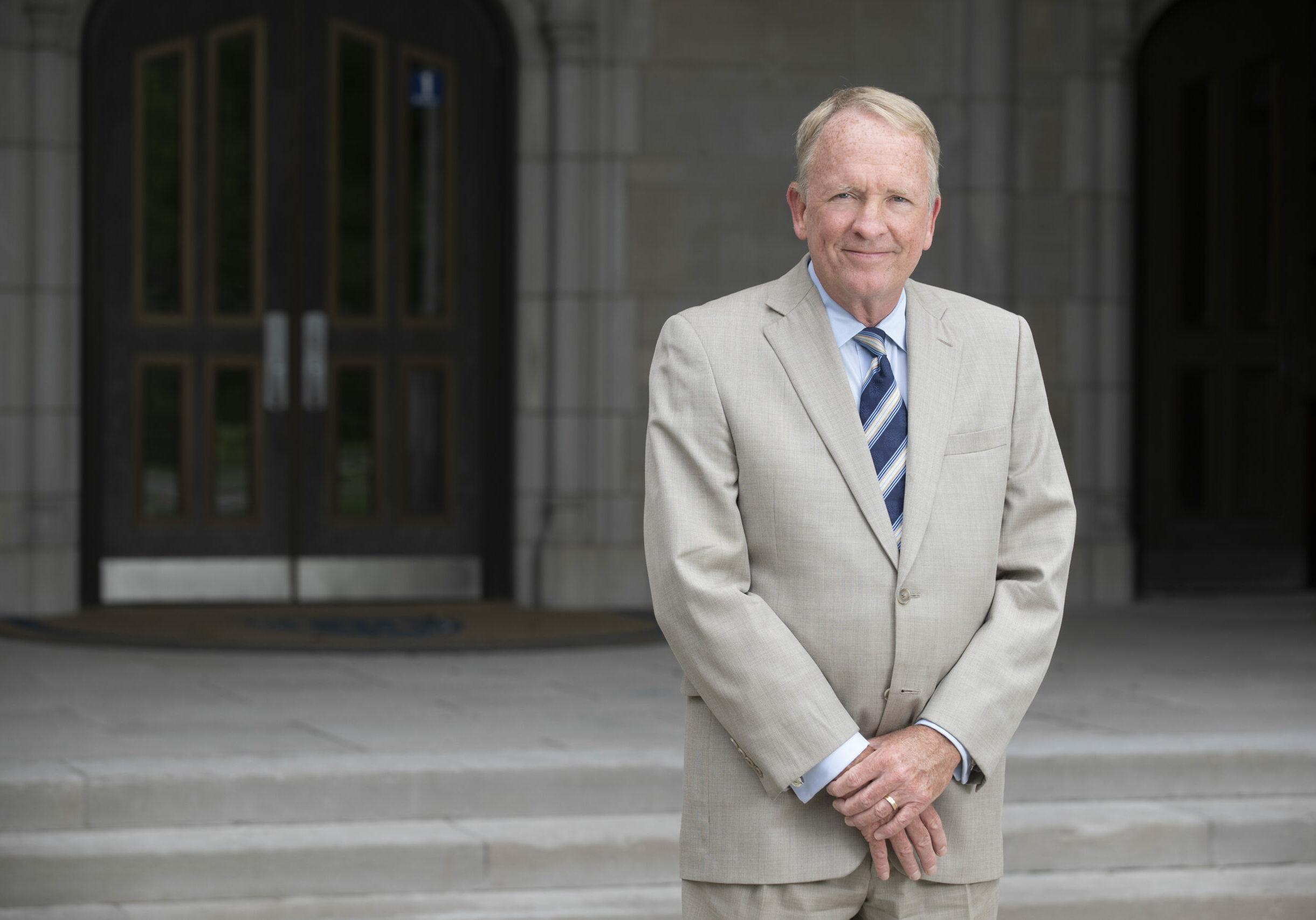 Portraits of Interim President Gregory Postel in front of University Hall